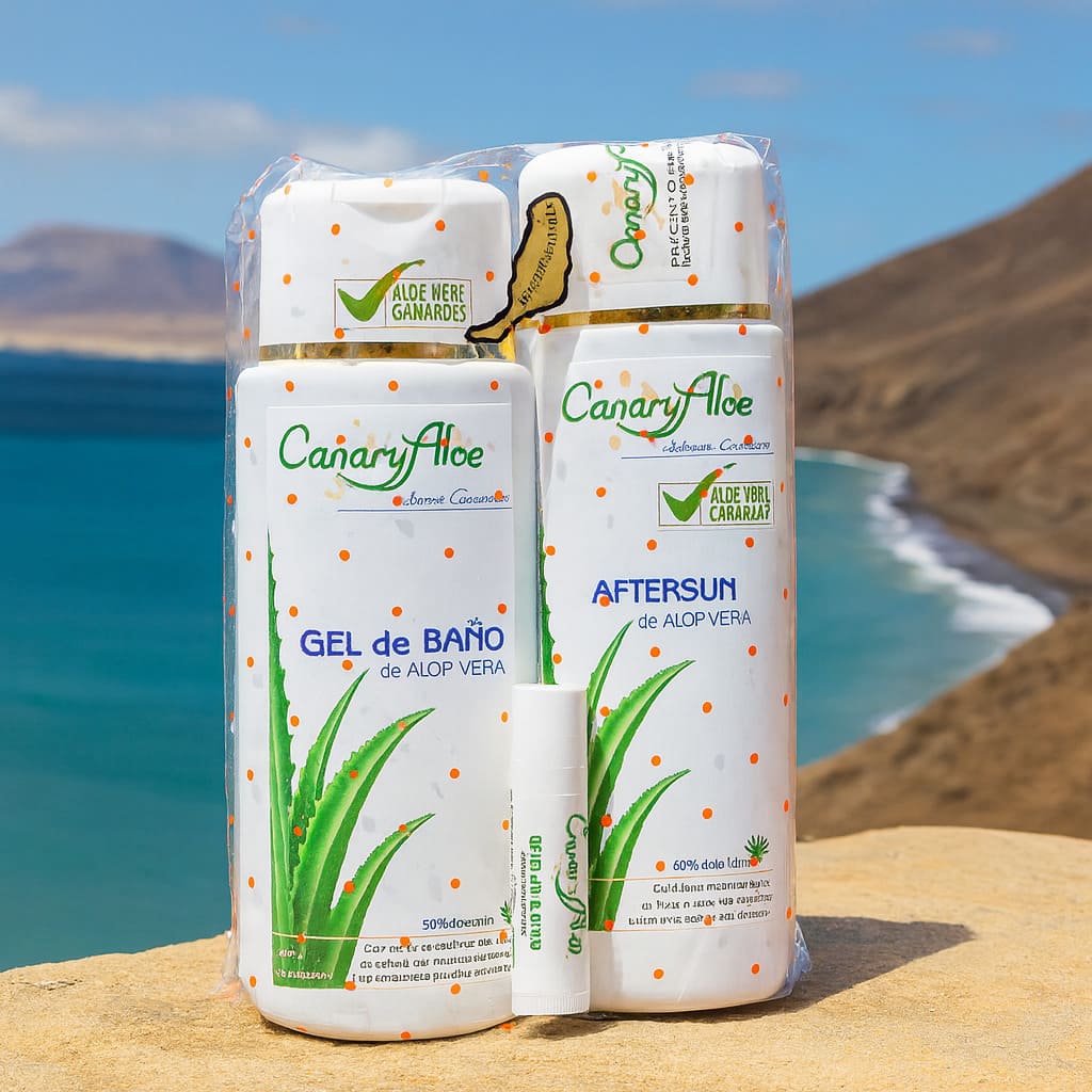 Pack Esencia de Aloe Vera de CanaryAloe con gel de baño, after sun y protector labial, fotografiado con el mar y paisajes de Fuerteventura al fondo.